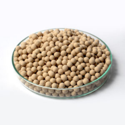 A molecular sieve variation in a round tray on a plain white background