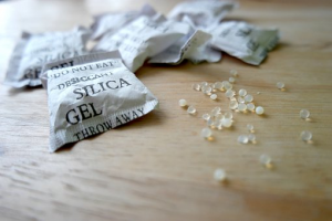 White silica gel packets with white, crystallized desiccant