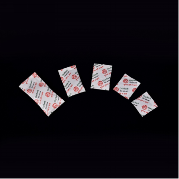 An assortment of OxySorb packet sizes against a black background